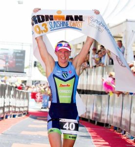 Gina Crawford celebrates victory at Ironman 70.3 Sunshine Coast