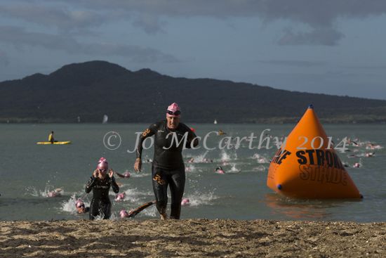 Competitors coming out of the water