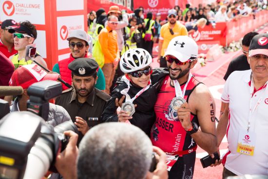 Shaikh Nasser took 12-year-old Ghanim, born without legs, on the swim, bike and run at Challenge Dubai